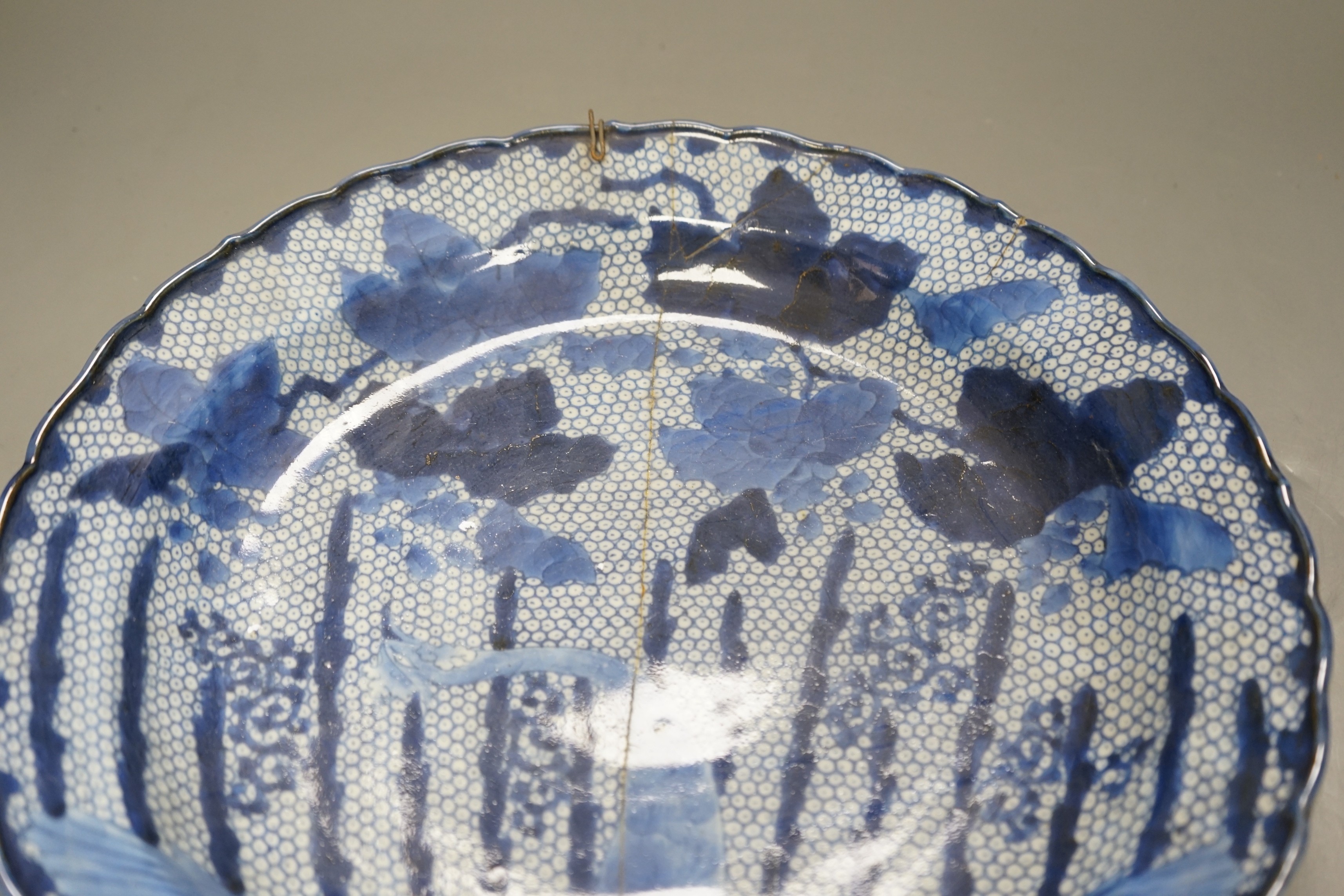 An 18th century Arita blue and white dish, 34cm